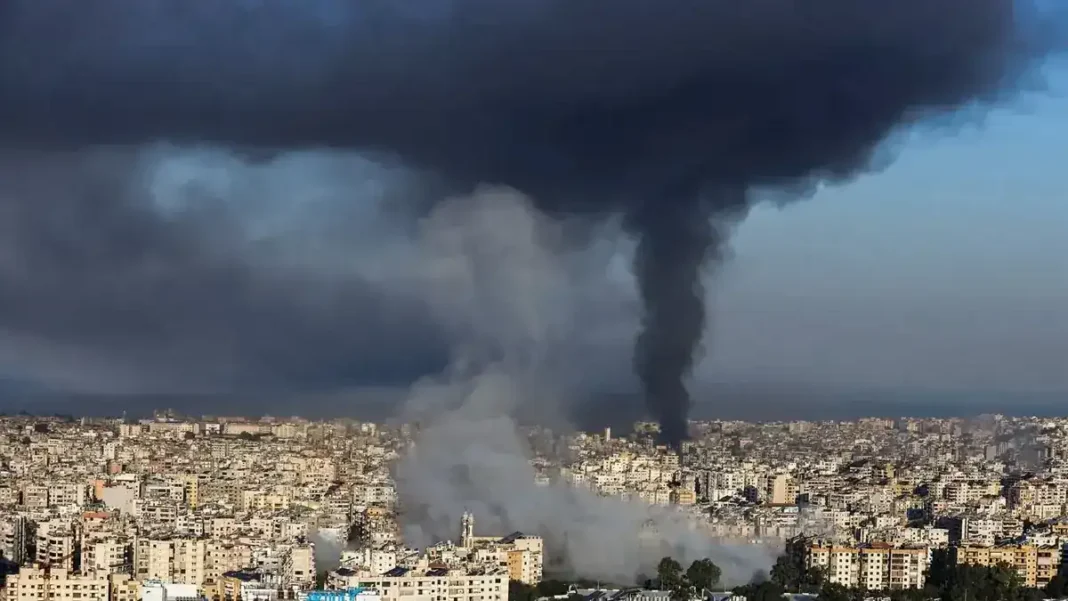 World Bank Warns Gulf War Could Disrupt Pakistan’s Debt Rollovers, Push Energy Bill Up 30% Black smoke rising over a city skyline. Pakistan debt Gulf war World Bank warning.