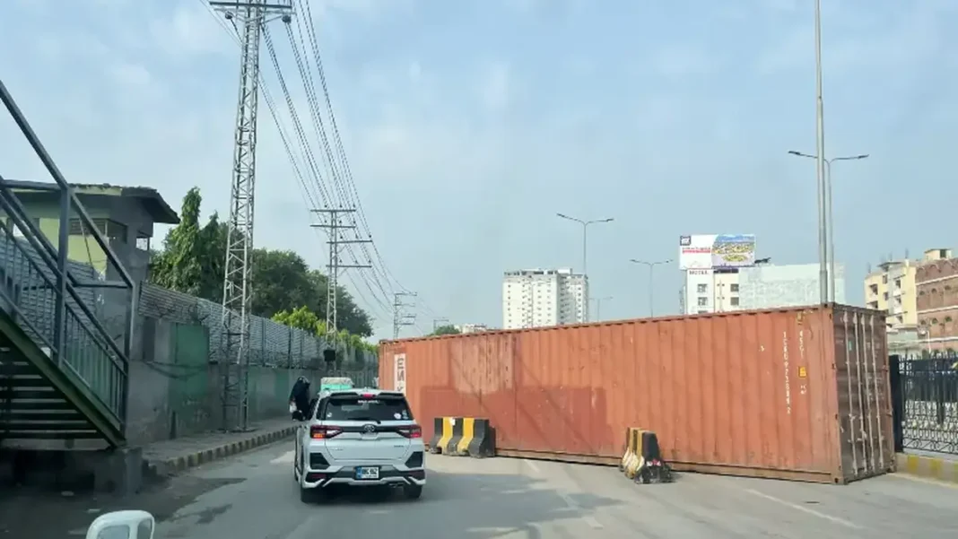 Containers Block Roads Across Peshawar After Emergency Imposed in KP A shipping container blocks a road in Peshawar as containers block roads in Peshawar following the imposition of emergency in KP