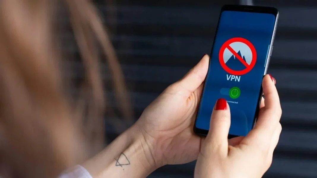 Pakistan tells government staff to use only approved VPNs Hands holding a smartphone with a VPN app open - Pakistan government VPN rules