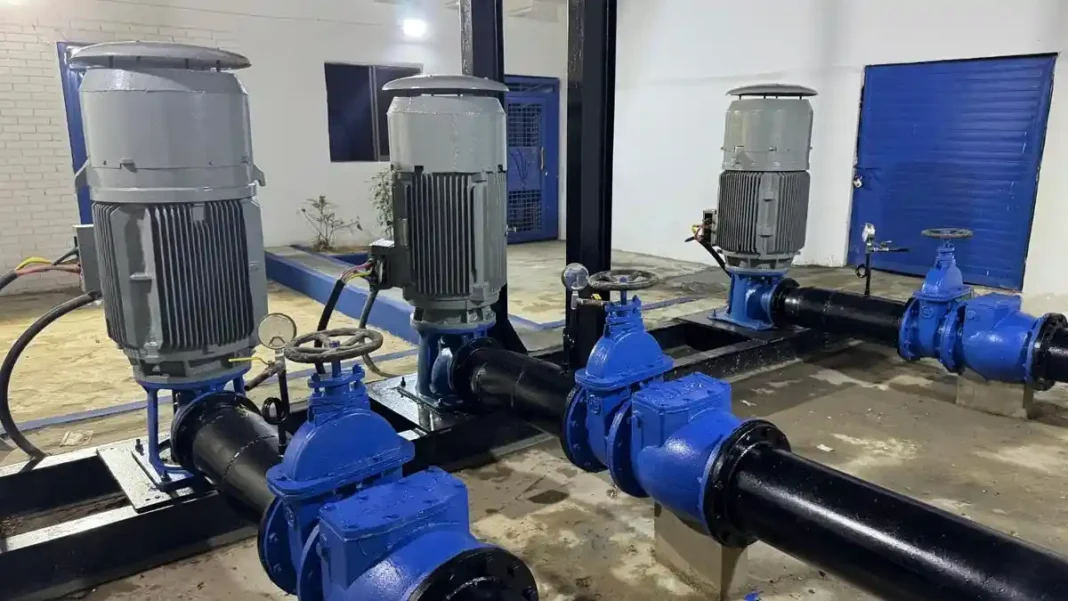 Karachi Pumping Station Upgrade Improves Supply Pumps and blue pipelines inside a water pumping station - Karachi pumping station