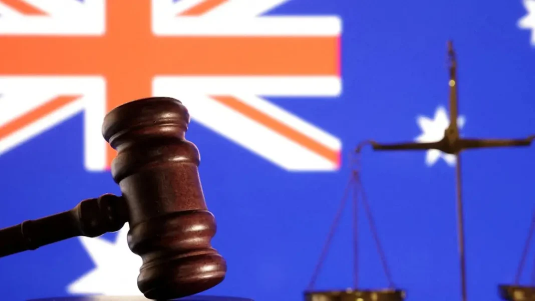 Australia Sanctions Two North Koreans Over Fraudulent IT Worker Scheme Australia sanctions North Korea: gavel and scales of justice before the Australian flag