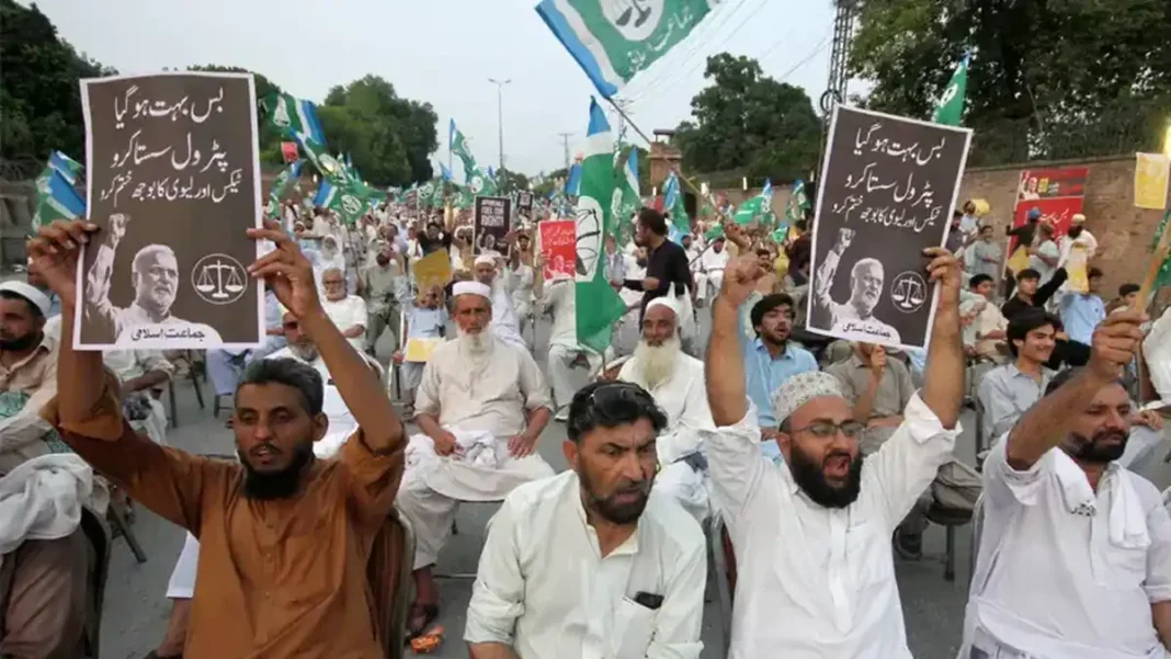 JI announces third wave of petroleum levy protest across Pakistan on Friday JI supporters holding party flags and placards at an anti-petroleum levy protest