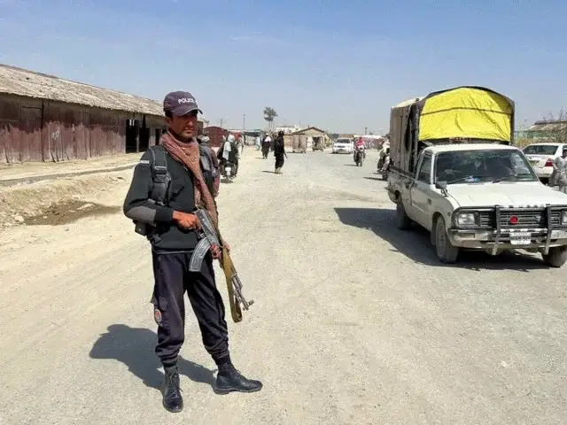 Pakistan Rejects Afghan Taliban Casualty Claims Police officer stands guard at the Chaman border crossing - Pakistan rejects Afghan casualty claims