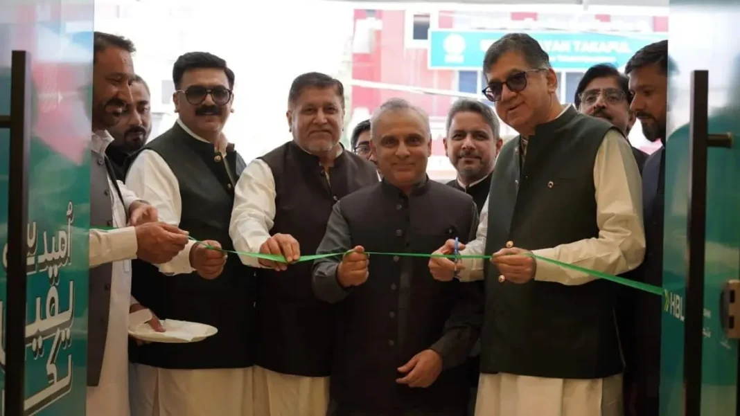 HBL Microfinance Islamic Banking in KP HBL Microfinance Bank officials cut a ribbon — HBL microfinance Islamic banking