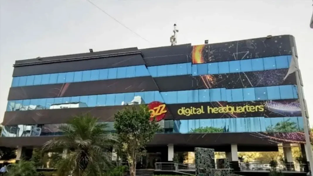 Jazz Launches ROX AI and ROX AI Hub with Urdu Voice Support A person holds a phone showing the Jazz ROX AI Hub with DeepSeek, Qwen and Kimi models — Jazz ROX AI launch in Pakistan.