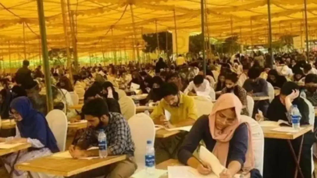 JI Demands Independent Retest for Top 100 MDCAT Candidates, Audit of Rs1.26bn Exam Fees Candidates seated at desks during the MDCAT 2026 examination, for which JI has demanded a retest