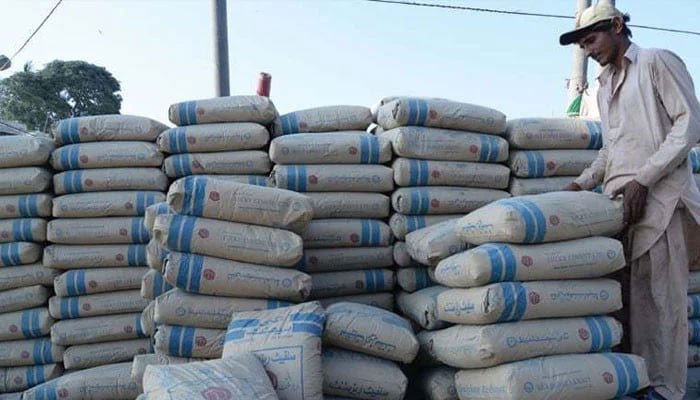 Cement sales rise 7.35% in September as domestic demand strengthens Labourer alongside stacked cement bags in Pakistan as cement sales rise in September