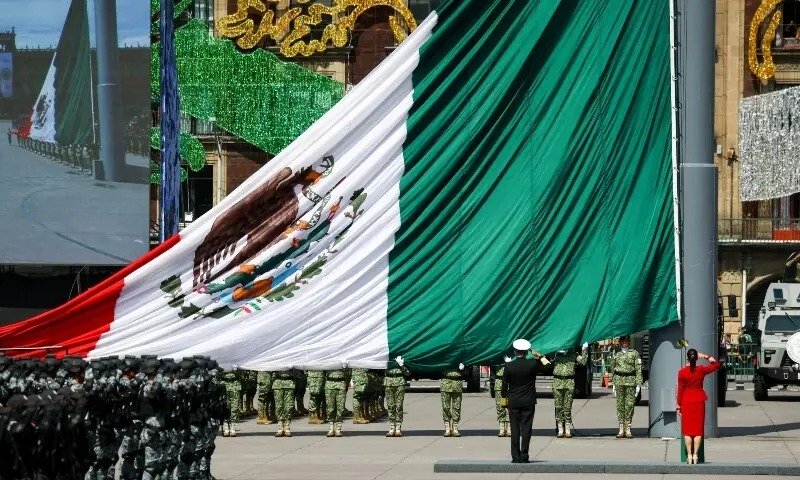 Mexico’s dual-nationality ban for presidents advances as states ratify Mexico's flag during a ceremony as the dual nationality ban advances