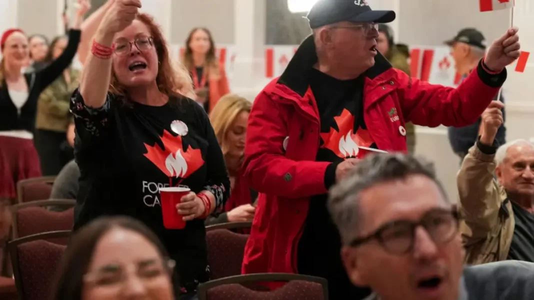 Alberta Votes by Large Majority to Remain Part of Canada, Boosting Carney Supporters waving Canadian flags at a rally; the Alberta referendum result saw 76 per cent vote to remain in Canada