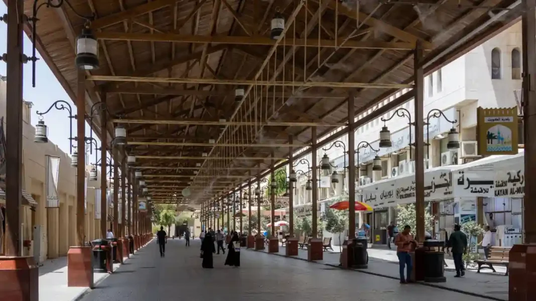 Kuwait Launches Centralised Wage Payment System for Private Sector Busy market street in Kuwait; Kuwait wage payment system to monitor private-sector salaries