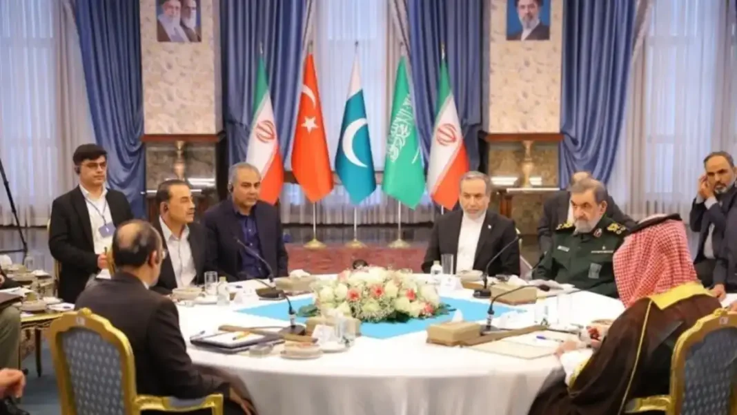 Pezeshkian Urges Regional Unity at Tehran Talks Officials at the Tehran regional unity meeting with the flags of Iran, Turkiye, Pakistan and Saudi Arabia
