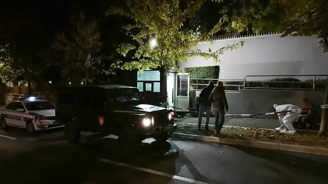 Serbia Israeli Embassy Incident Leaves Attacker Dead Police vehicles and officers outside the Israeli embassy in Belgrade at night — Serbia Israeli embassy incident