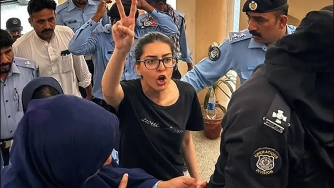 ATC Replaces State Counsel in Imaan Hadi Case After Couple Objects to Appointment Imaan Mazari raises a victory sign surrounded by police — the ATC replaced the state counsel in the Imaan Hadi case after the couple objected.