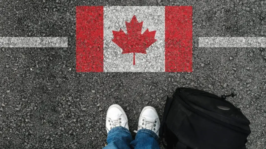 Canada Announces New Express Entry Rules for Permanent Residency Applicants Canada Express Entry new rules — a traveller with the Canadian flag as Canada announces new permanent residency rules