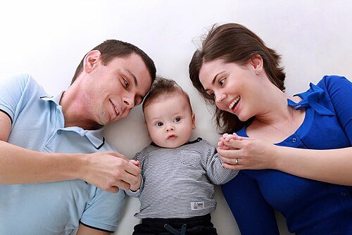 How Much Life Insurance Do You Need? 2026 Guide how much life insurance do i need: parents protecting their baby