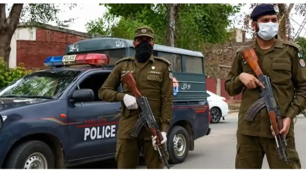 Suspect Held in Rawalpindi Mother-Daughter Murder Masked Punjab police officers beside police vehicle — Rawalpindi mother daughter murder arrest