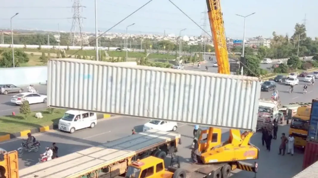 Twin Cities Clear Roadblocks as Police Begin Pullback Twin cities roadblocks cleared — crane lifting a shipping container off a highway