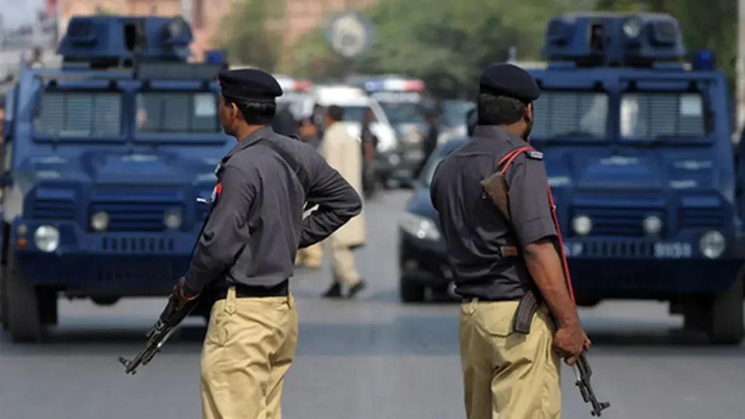 Two Die in Karachi Trailer Crash on Mai Kolachi Road Police personnel at a roadside amid Mai Kolachi Road accident Karachi