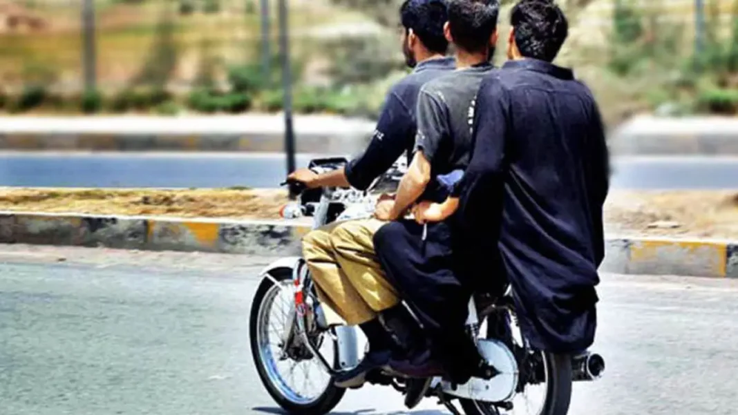 Bajaur Bans Pillion Riding for 10 Days on Security Fears Three men riding on one motorcycle — Bajaur pillion riding ban