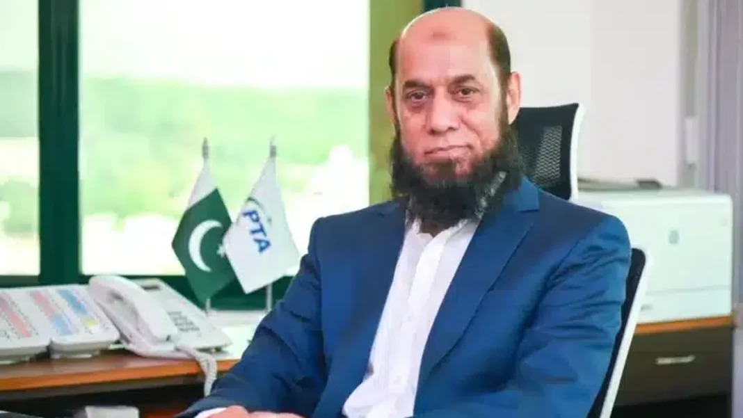 PTA Warns of Rising Online Fraud Across Pakistan PTA chairman at his desk with Pakistan and PTA flags — online fraud Pakistan