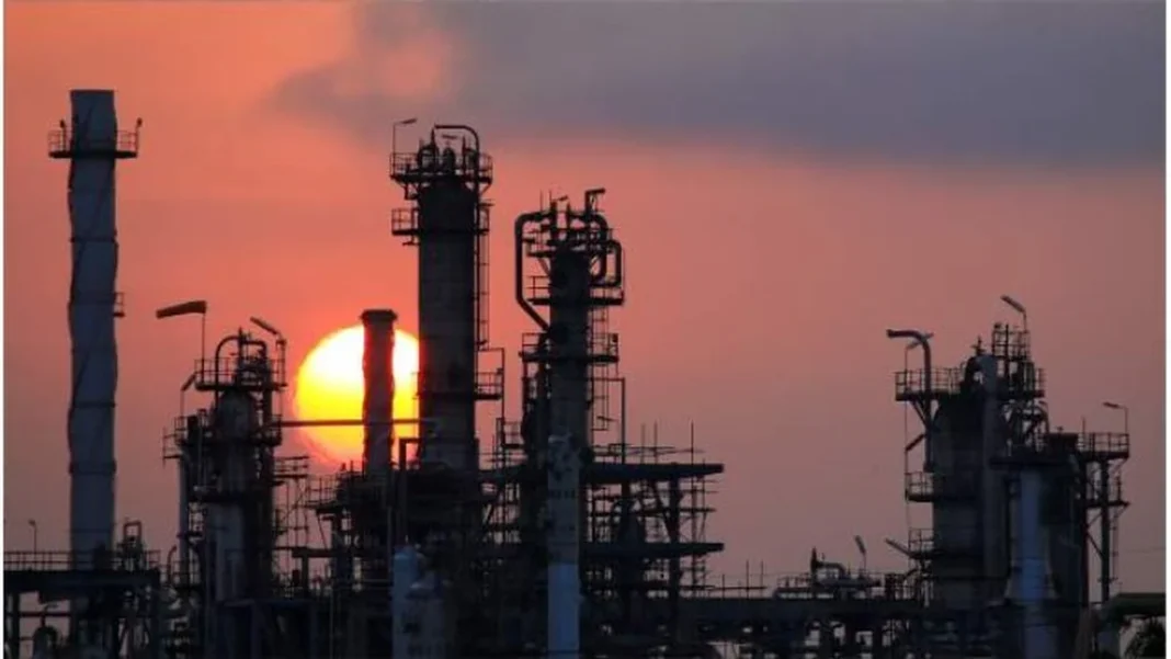 Pakistan Refineries Meet a Third of Petrol Demand Oil refinery towers against sunset — Pakistan refinery petrol production