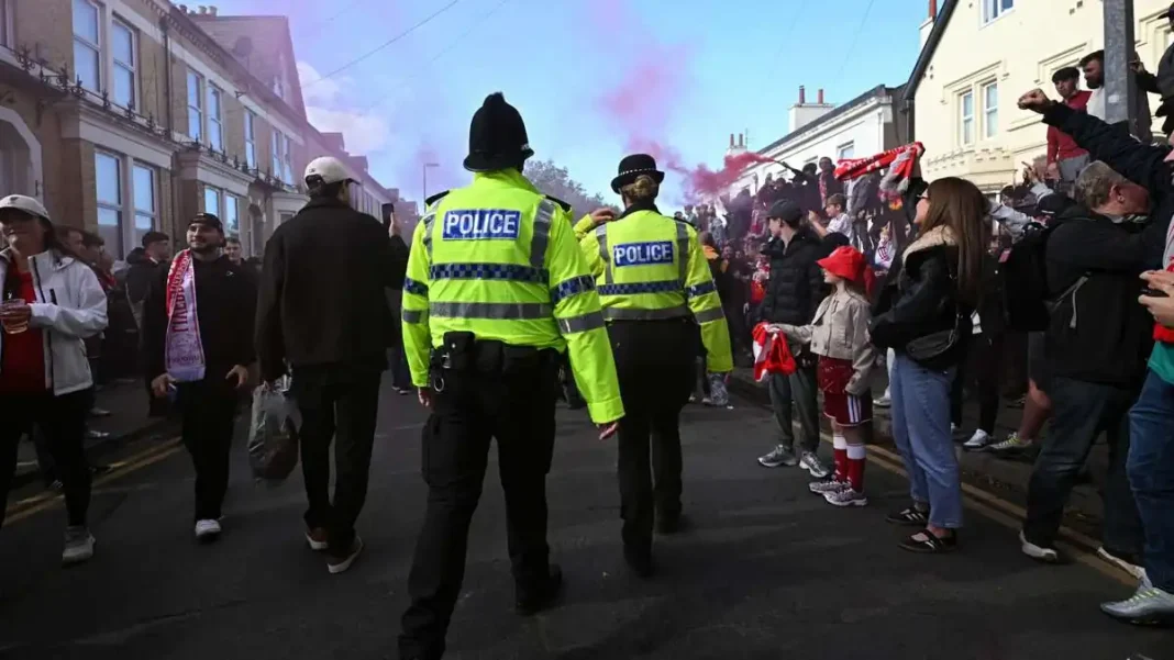 Ten arrested after crowd trouble mars City win at Anfield Police officers outside Anfield after Manchester City beat Liverpool 3-0 in the Premier League