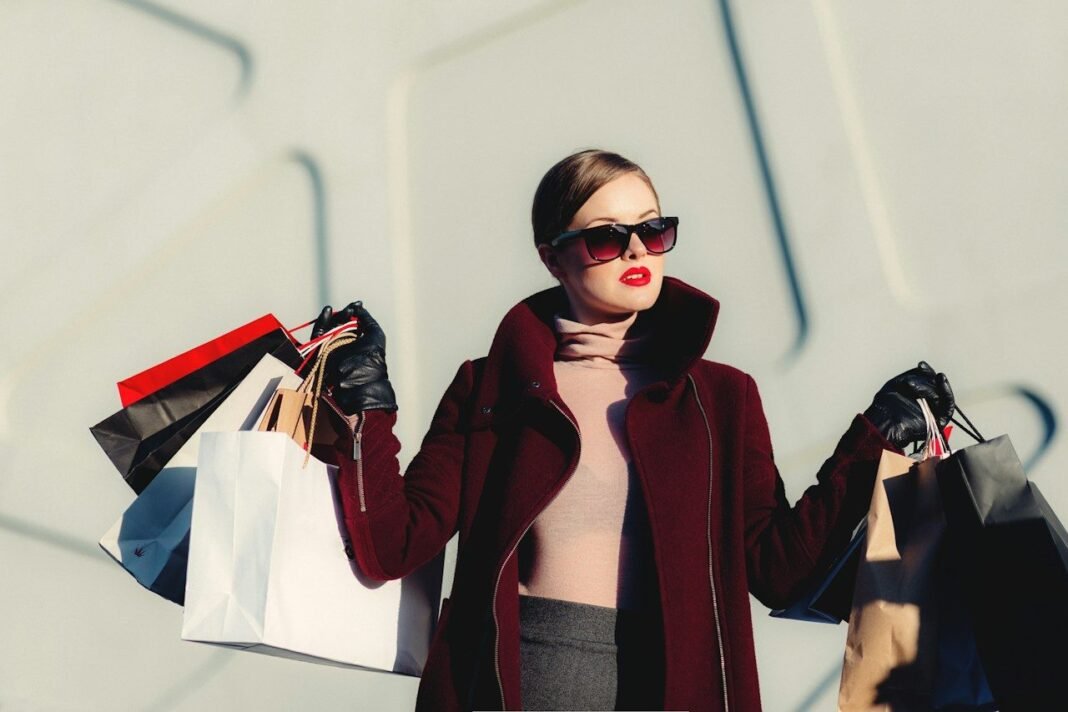 No-Spend Month Challenge: Rules, Exceptions and a 30-Day Plan That Works Woman holding shopping bags, the temptation a no-spend month challenge asks you to pause