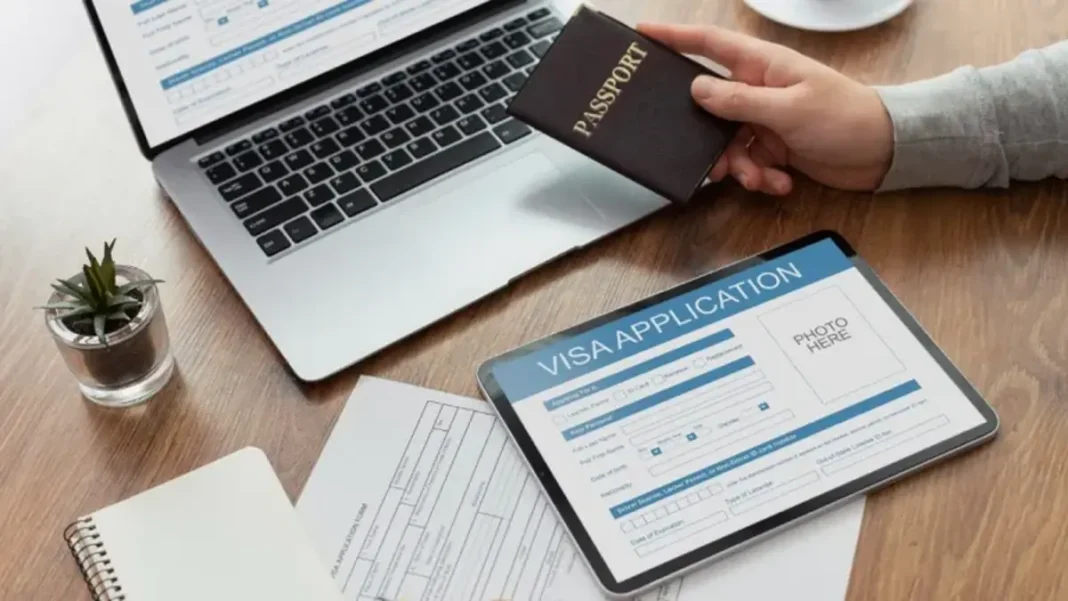 Pakistan Online Visa for Afghanistan: How Afghan Citizens Apply (2026 Guide) Person applying for a visa online using a laptop with a passport nearby