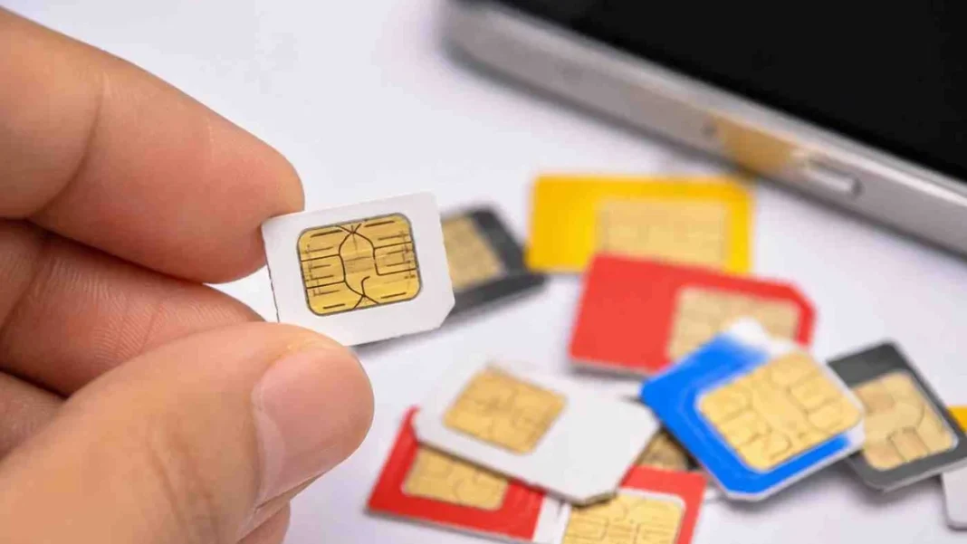 PTA Proposes Registration for Travel SIM, eSIM Firms PTA travel SIM eSIM registration: SIM cards beside a smartphone